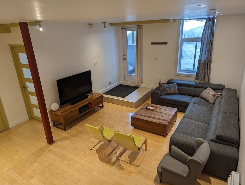 Very spacious family room with TV