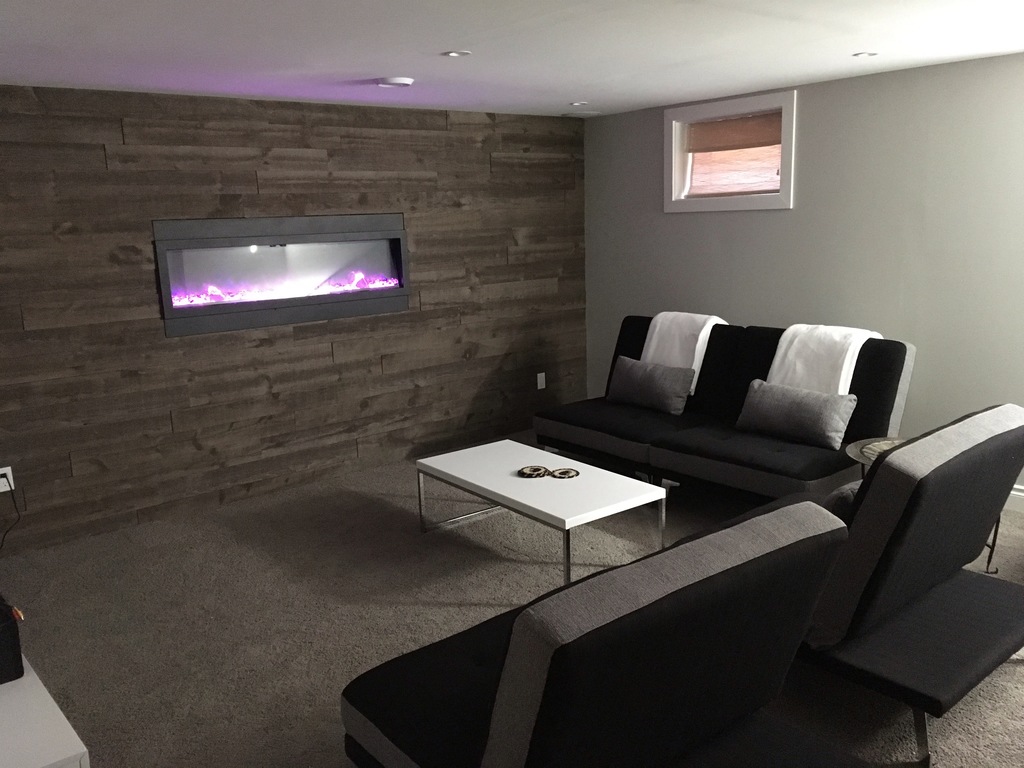 Lower level living area, 34 sq meters, electric fireplace, all brand new in 2017.