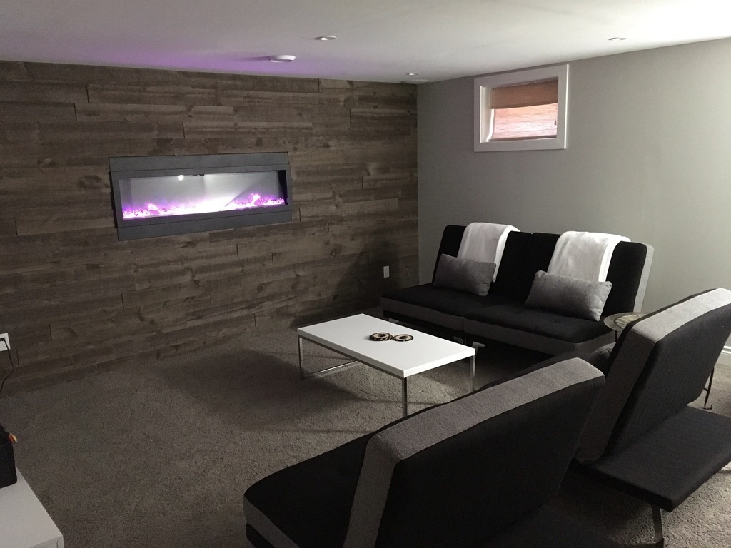 Lower level living area, 34 sq meters, electric fireplace, all brand new in 2017.