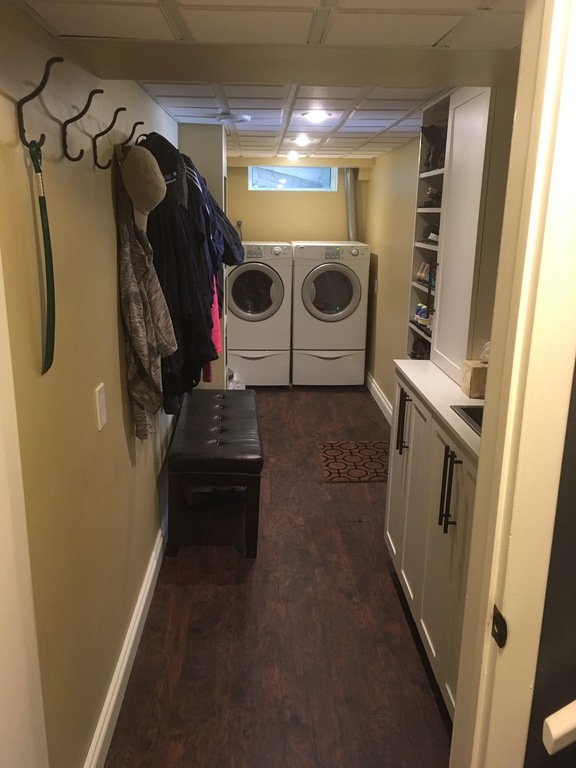 Laundry room, with mudroom entrance from garage.  Coat and shoe storage.