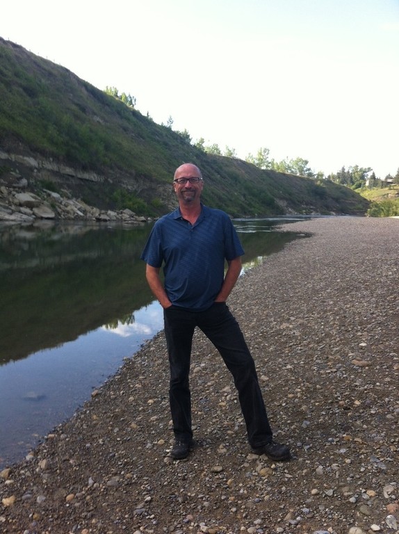 Alan standing beside Elbow River west of our home