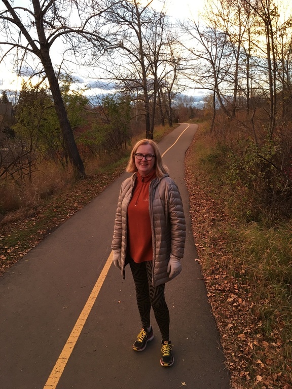 Theresa on trail thru Stanley park in October.