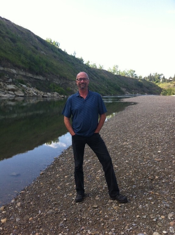Alan standing beside Elbow River west of our home