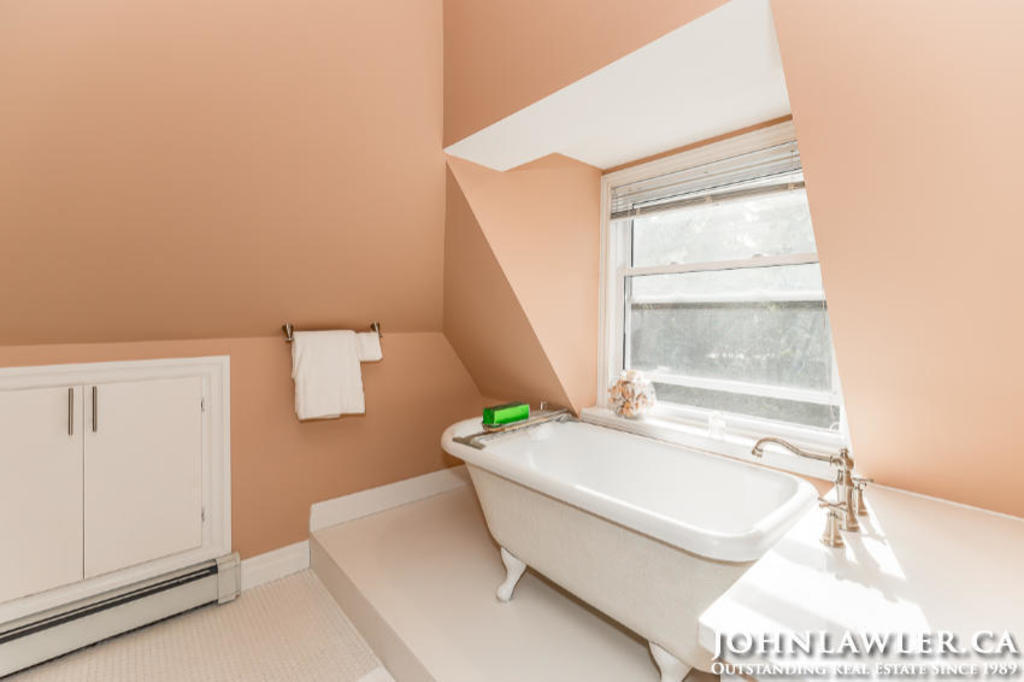 Soaking tub in 3rd floor bathroom, overlooking the backyard and forest