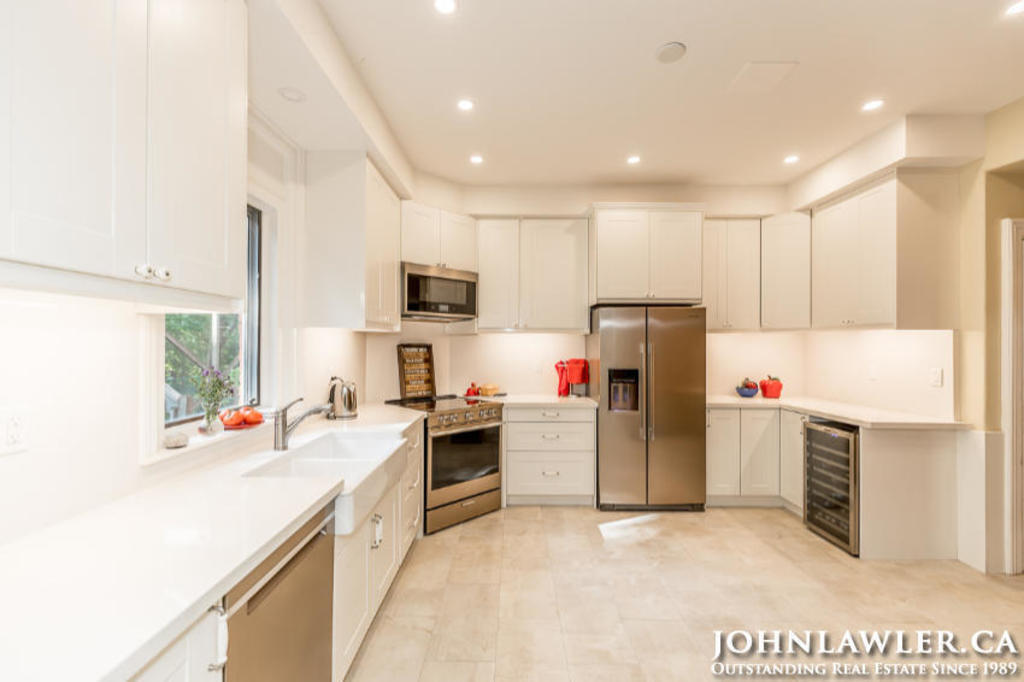 Large kitchen with full size fridge/freezer, oven, wine fridge, dishwasher