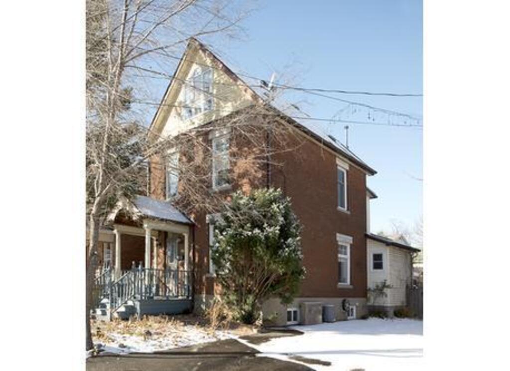 spring view of the outside of our century home 