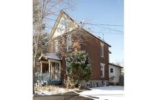 spring view of the outside of our century home 