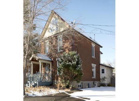 spring view of the outside of our century home 