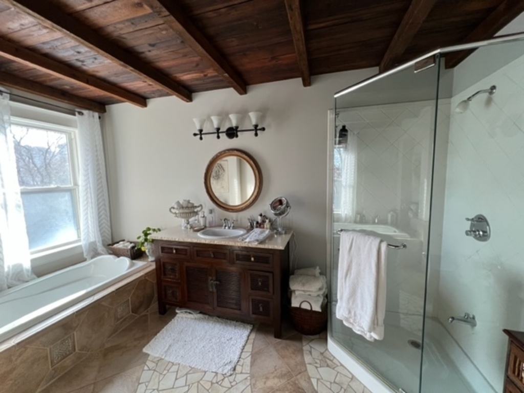 Second floor main bathroom with soaker tub and shower