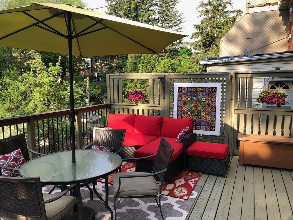 Elevated deck off of kitchen with private garden below