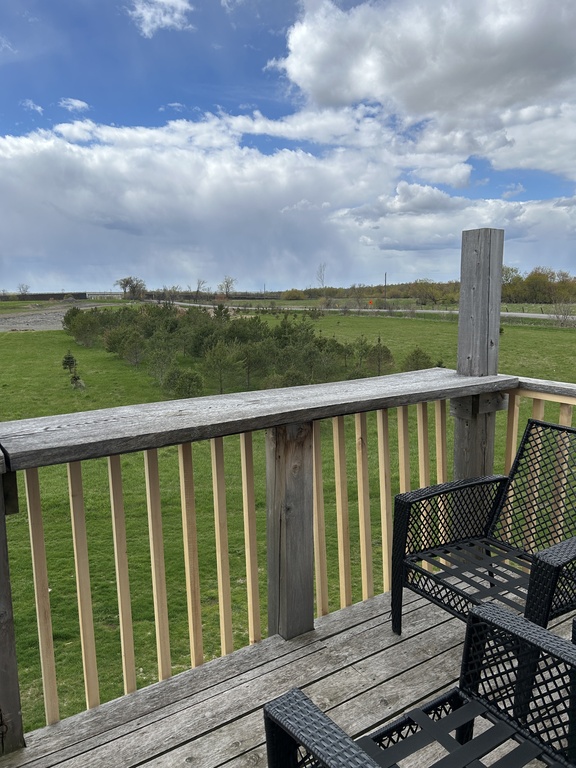 The balcony looks out across farmland, however in the distance you can see the train line which will take you directly into t...