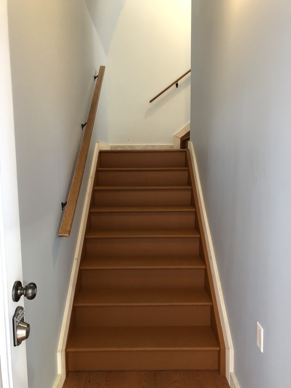 Stairs lead up to the second floor apartment