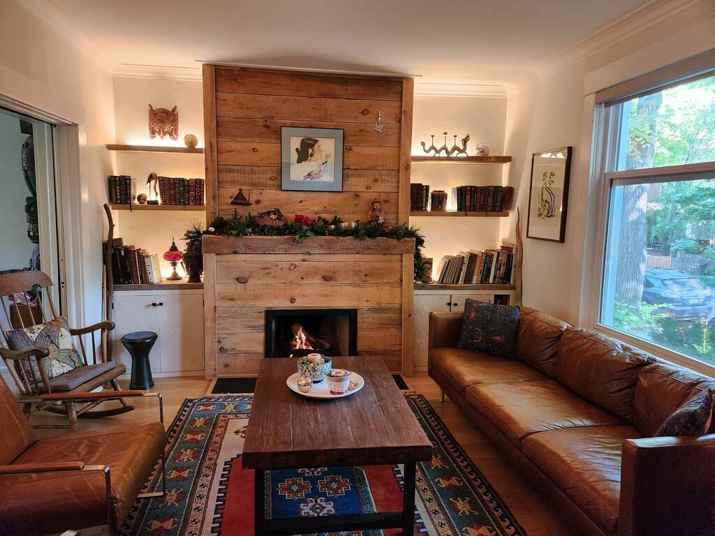 Cosy living room with reclaimed wood gas fireplace and lots of natural light