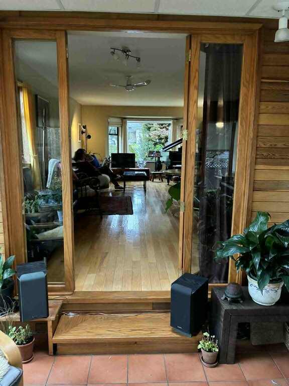 sun-room opens up into the house providing much light, views over the book yard