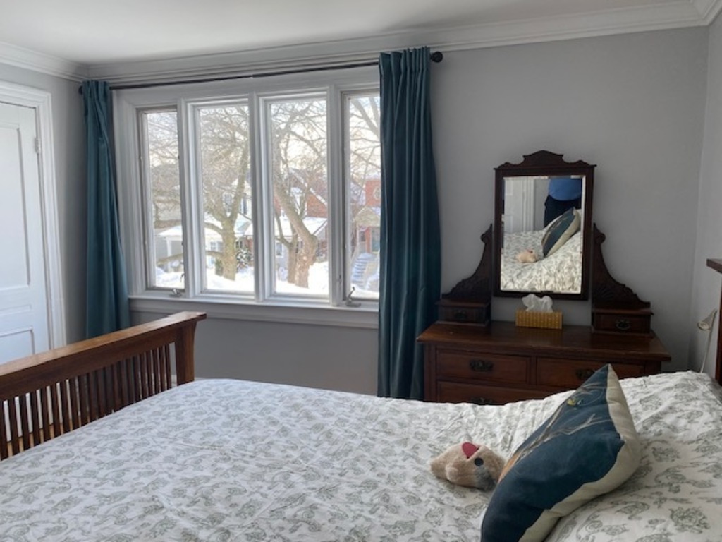 Main bedroom has a queen sized bed and is bright and airy. 