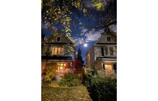 Our house (on the left) during a full moon! Front porch perfect for watching the world go by and chatting with neighbours.