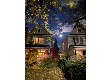 Our house (on the left) during a full moon! Front porch perfect for watching the world go by and chatting with neighbours.