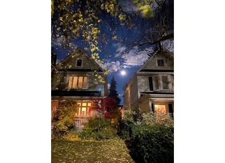 Our house (on the left) during a full moon! Front porch perfect for watching the world go by and chatting with neighbours.