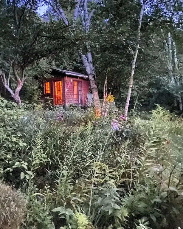 Separate sleeping bunkie with french doors and front porch.