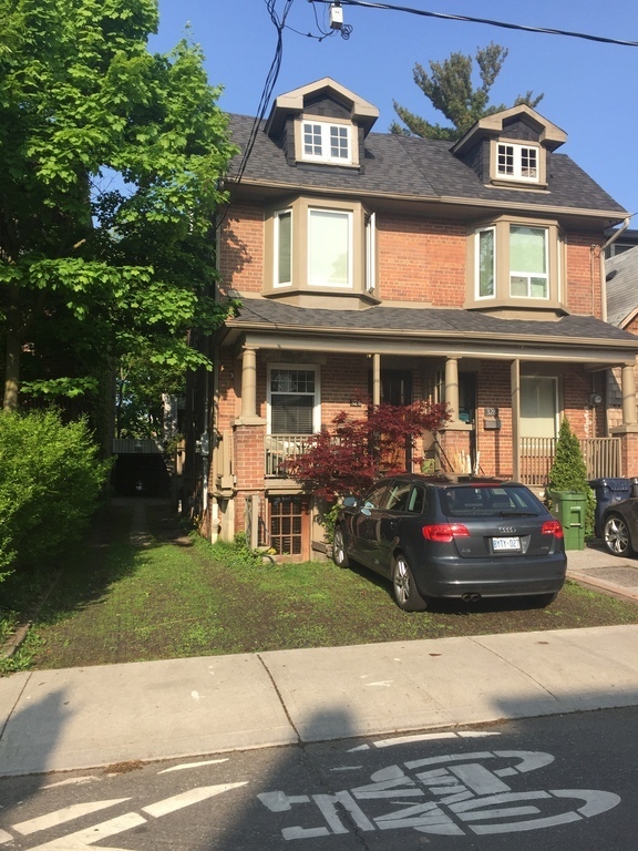 House on the left. Room to park a small car in front