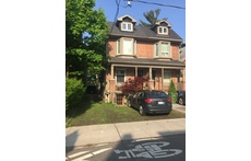 House on the left. Room to park a small car in front
