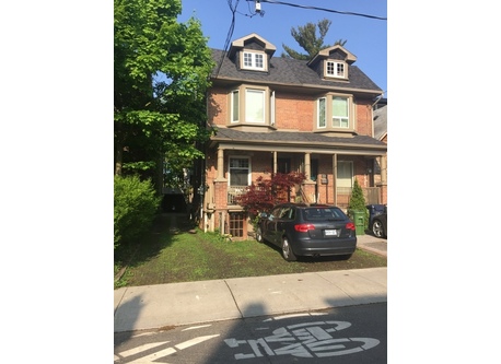 House on the left. Room to park a small car in front