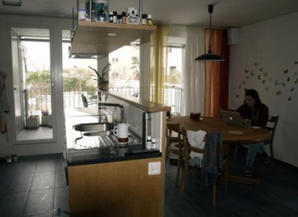 First floor. Dining room next to the open kitchen with an other balcony to the south.