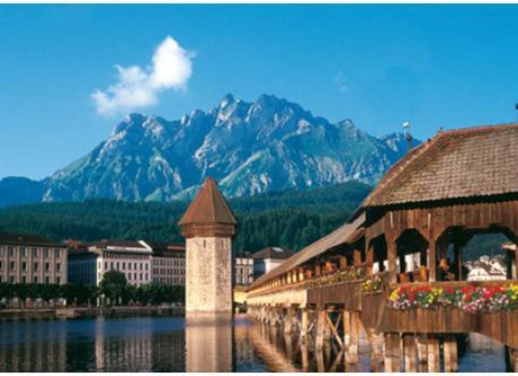 The famous chapelbridge at Lucerne with mount Pilatus.