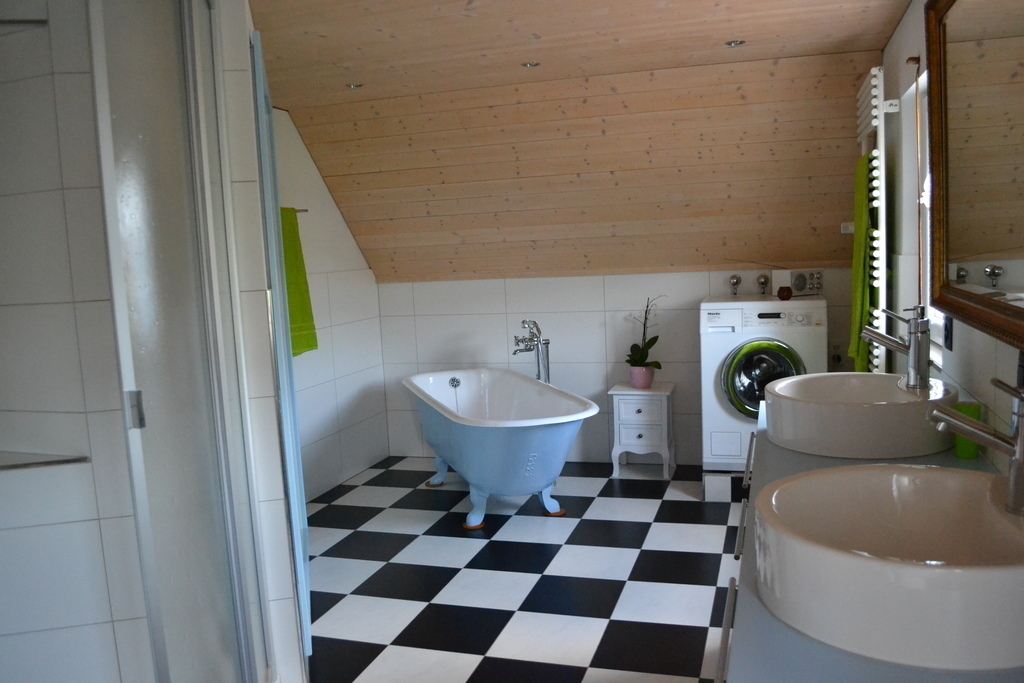 bathroom with toilet, shower, bath and 2 sinks on the first floor