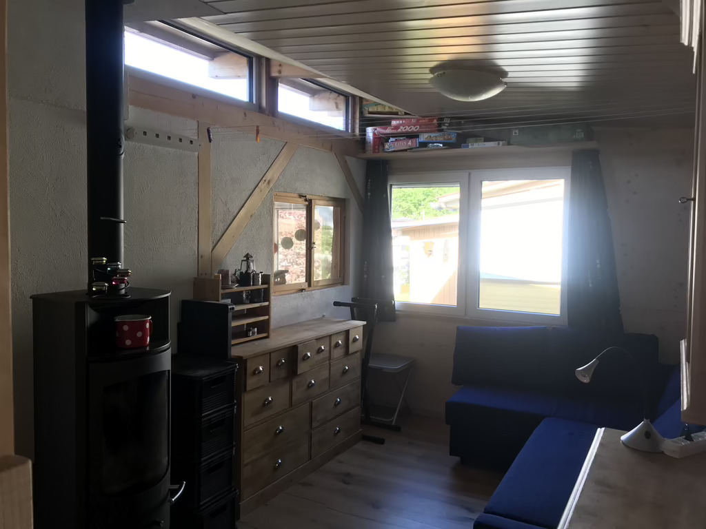 second home - living room with wooden stove