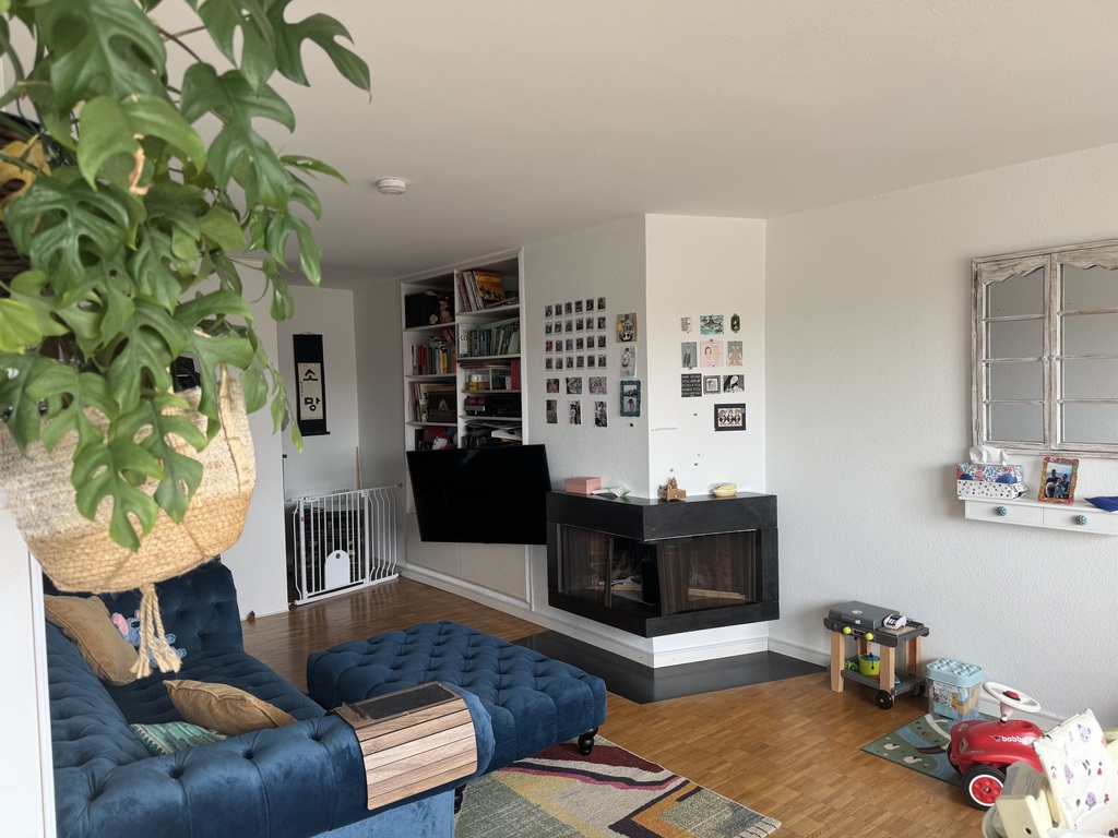 Living room with fire place and access to large balcony 