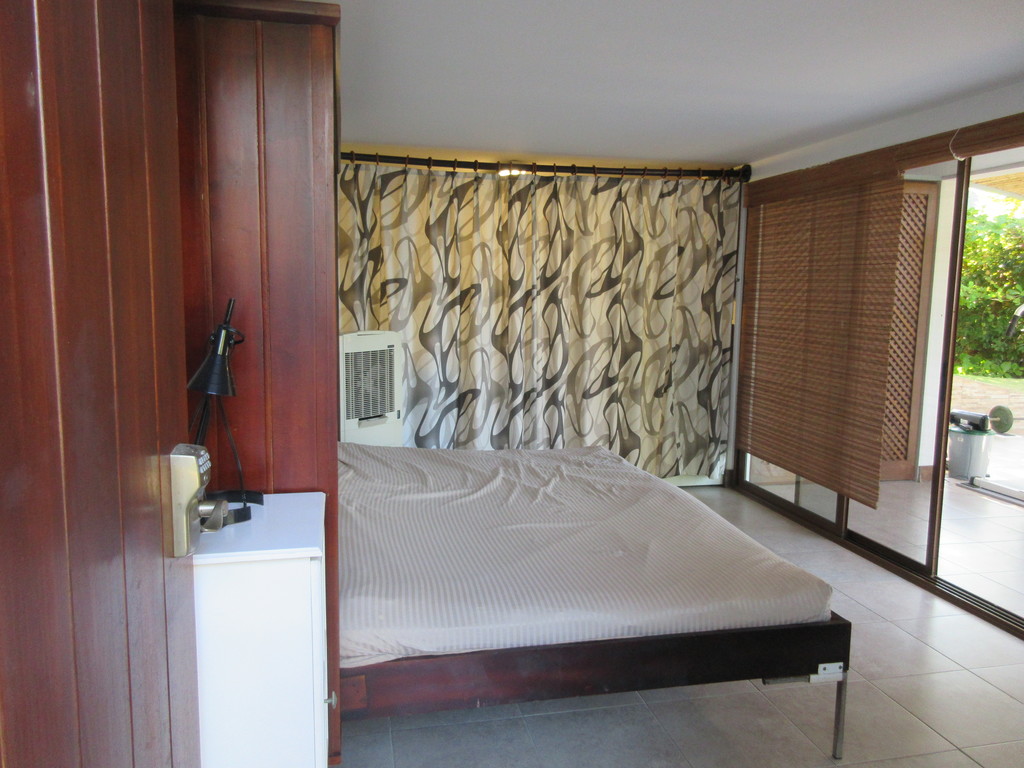 Queen bed by gym area - for young at heart 