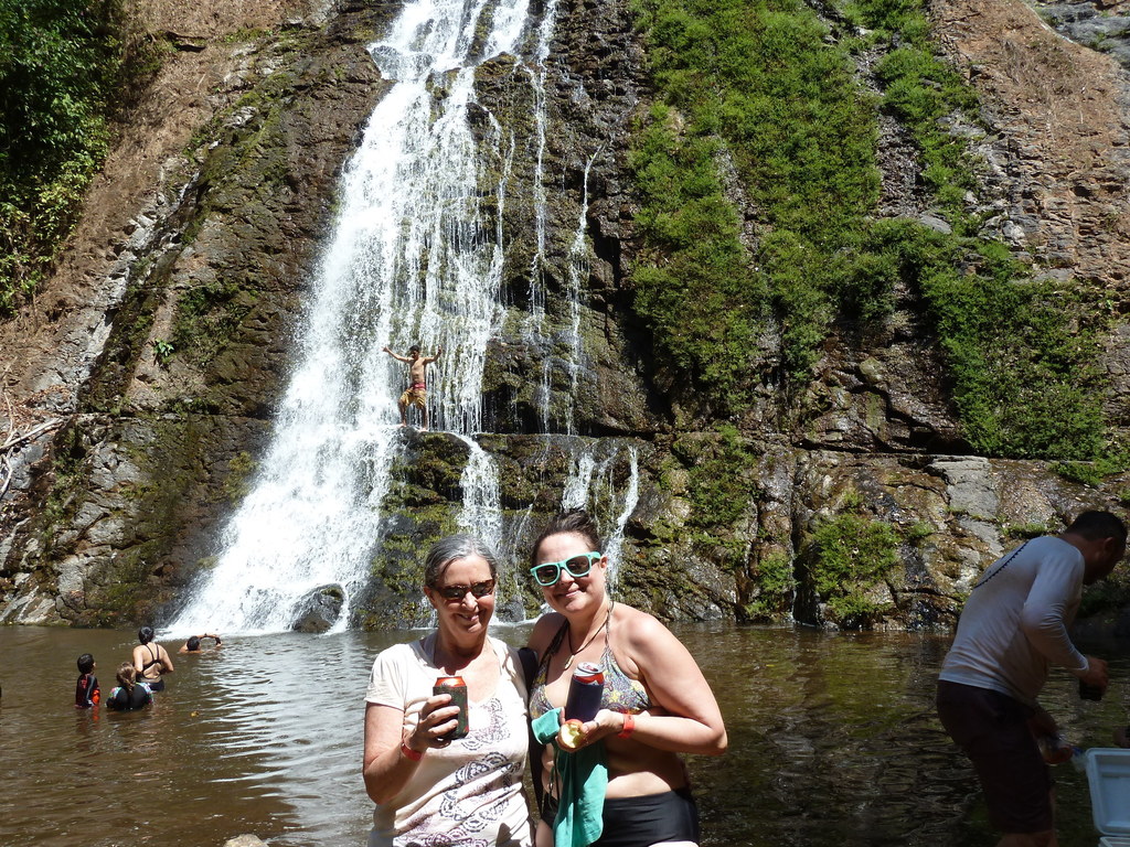 Friends enjoying a waterfall experience 