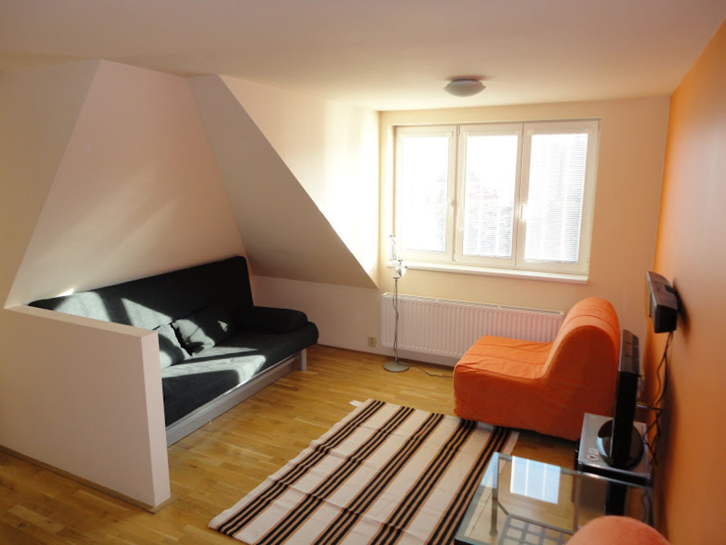 main living area with expandable sofa and chairs