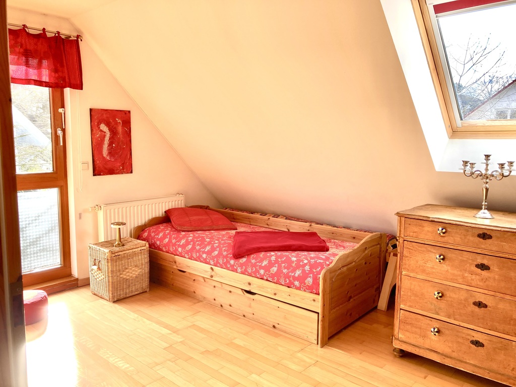 room with another single bed and spare bed