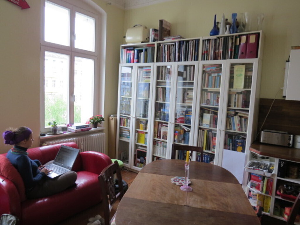 View into kitchen-dining room with library