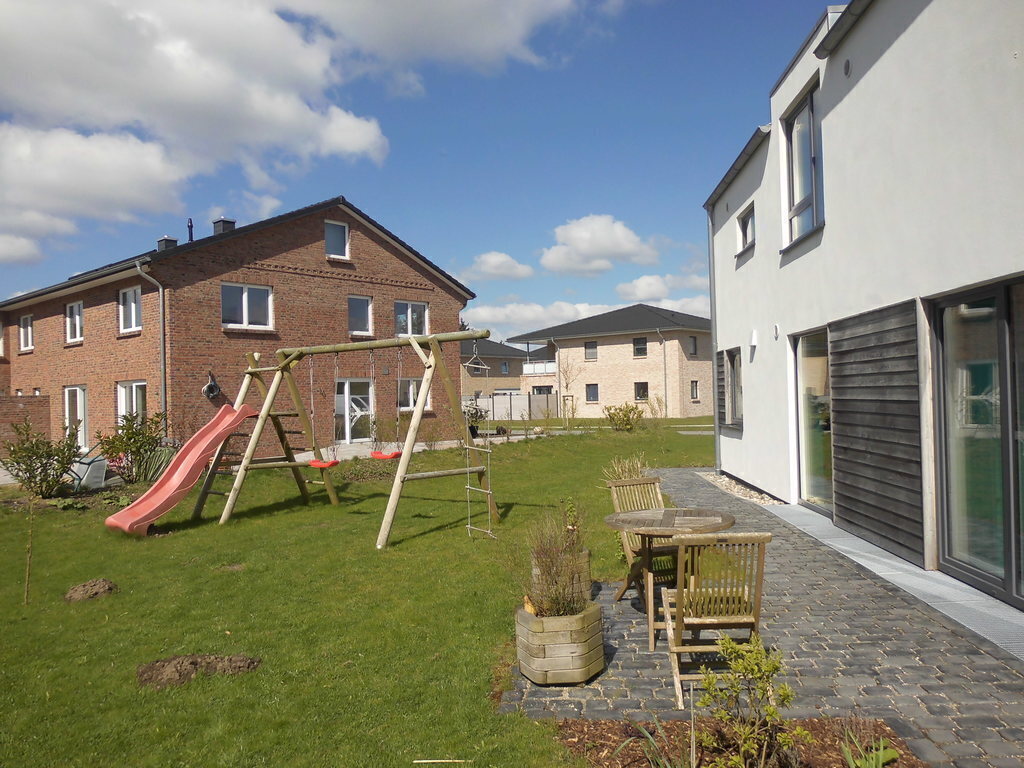 The white house is our home, swing and slide