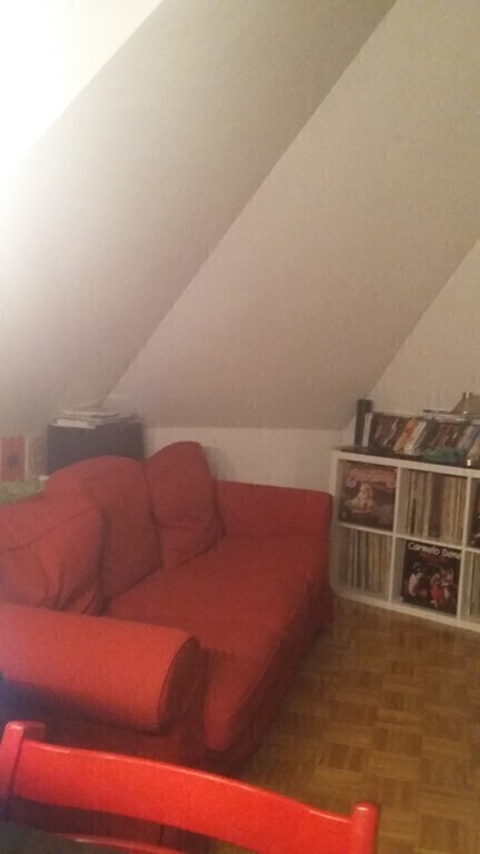 ...and a cozy red couch (changeable into a sofa-bed) ...