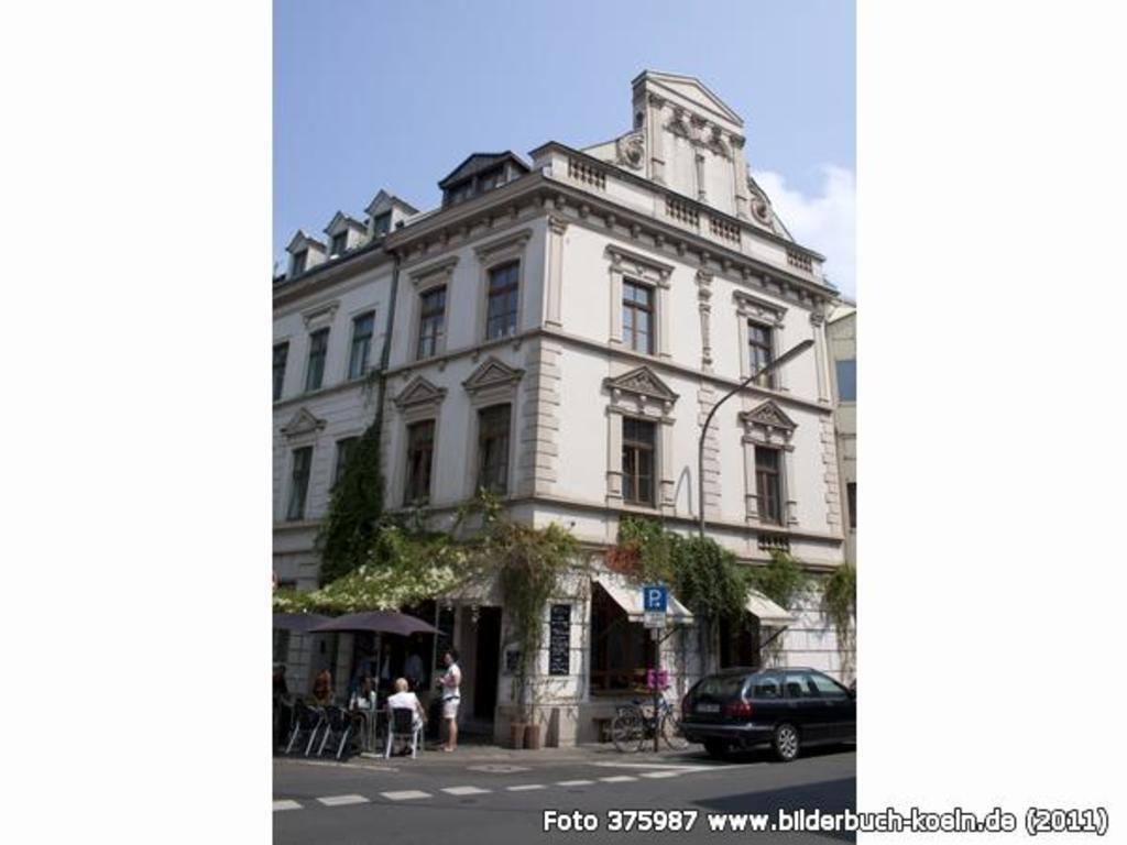 ...directly vis-á-vis of our house is a smart & charming café, where you can get...