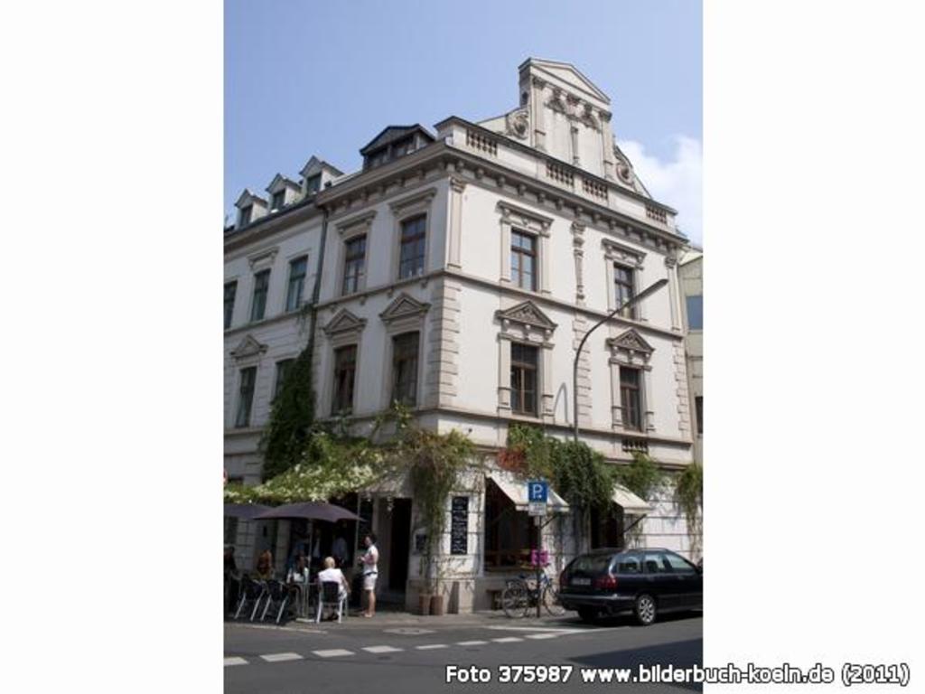 ...directly vis-á-vis of our house is a smart & charming café, where you can get...