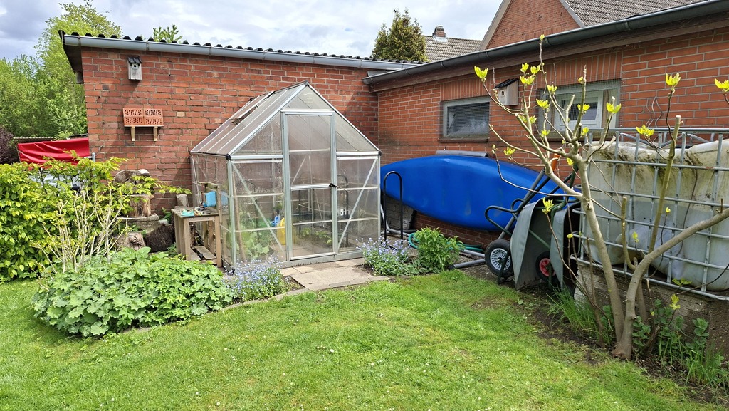 green house and canoe