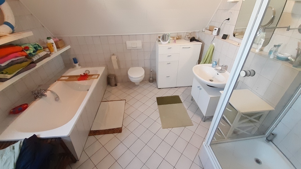 main bathroom upstairs with shower and bathtub
