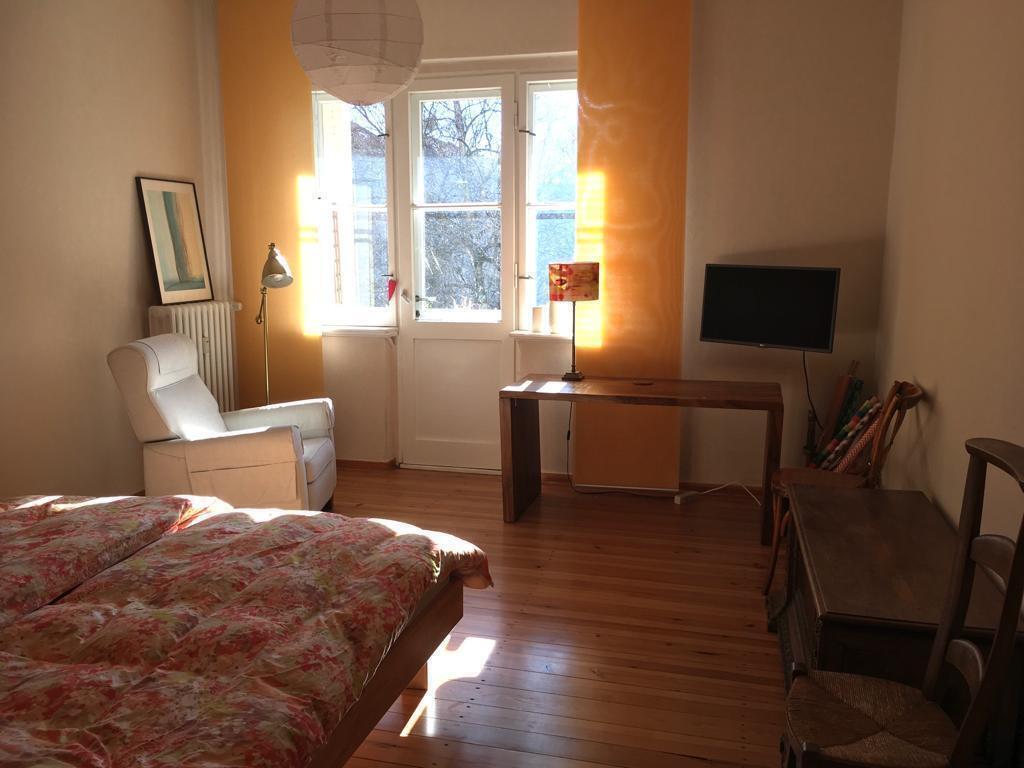sunny bedroom with balcony