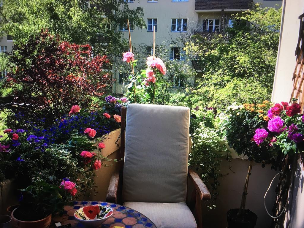sunny balcony with quiet garden with playground