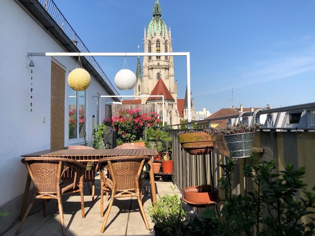 Rooftop terrace with dining table and lots of plants (and we have a barbeque)