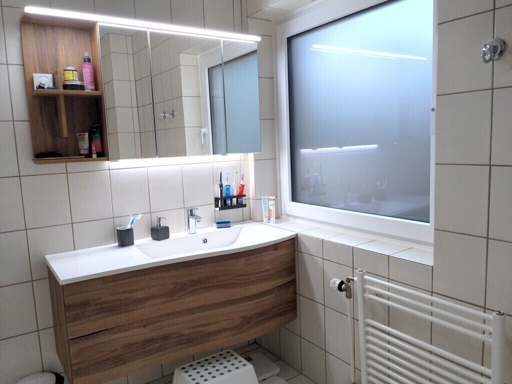 Upstairs bathroom with bath 