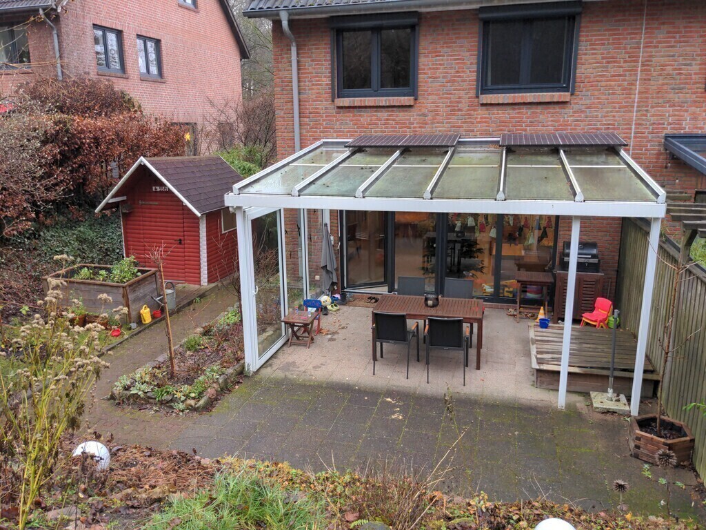 back of the house with roofed patio