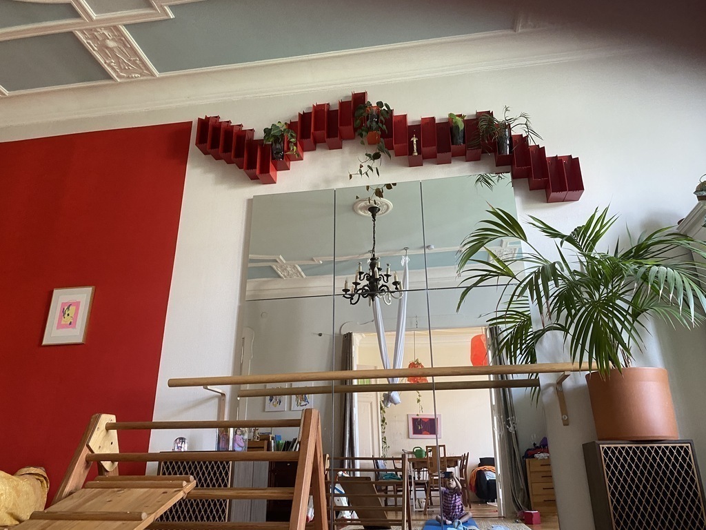 living room with bed and mirror.