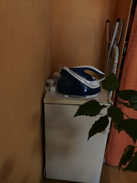 Iron and ironing board and additional refrigerator 