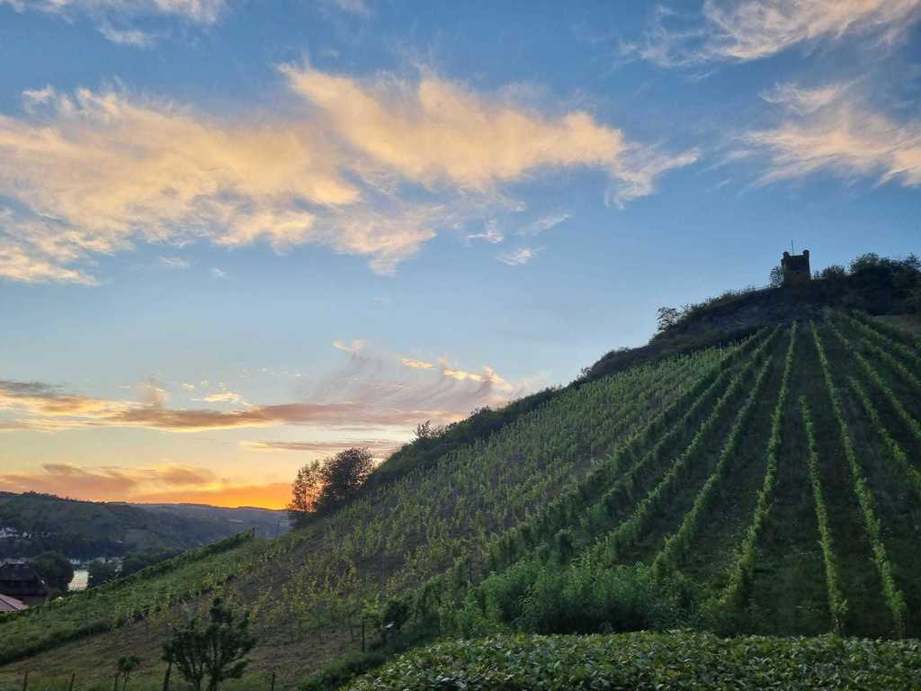 Evening with sunset behind the little castle opposite the house